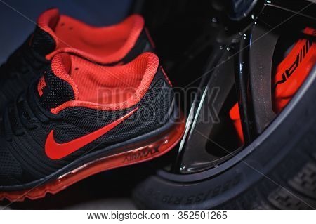 Perfect Nike Air Max 2017 Sport Shoes Shot Near The Mercedez Benz Car On Dark Background. Sport And