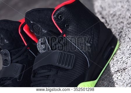 Legendary Nike Air Yeezy 2 Sport Shoes Shot Outdoor On Asphalt Road Line Background. Sport And Casua