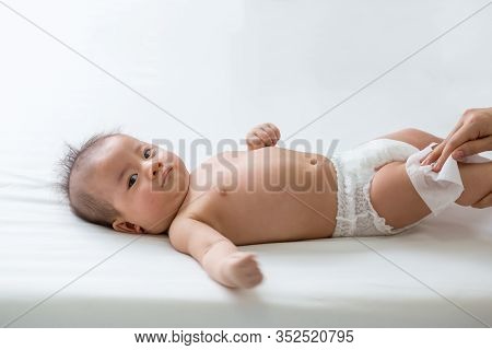 Mom Cleaning Up And Wipe Body Baby By Wet Tissue When Changing Nappies Or Diaper And Wiping The Hand