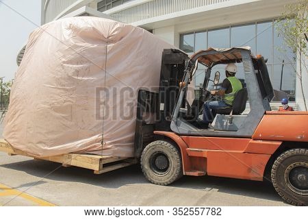 Orange Forklift Is Lifting Train Head For Driving Simulation