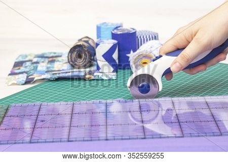 Fragments Of A Quilt, Accessories For Patchwork. The Seamstresss Hand Cuts The Fabric For The Quilt.