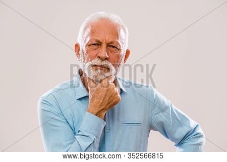Portrait Of Authoritative And Serious Senior Man.