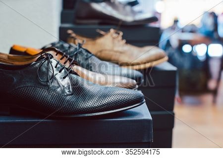 Men's shoes waiting for customers to buy them in store