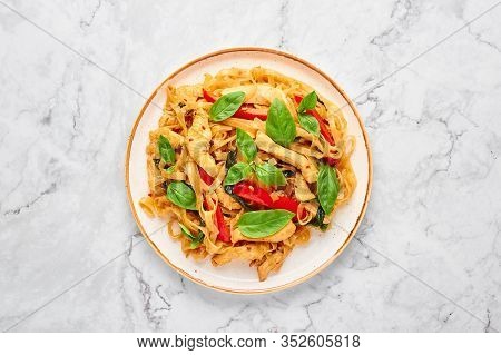 Thai Drunken Noodles Or Pad Kee Mao At White Marble Background. Drunken Noodles Is Thai Cuisine Dish