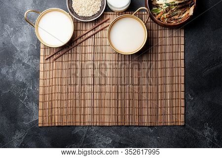 Makgeolli Rice Wine Is One Of The Oldest Korean Traditional Fermented Alcoholic Drinks On Dark Backg