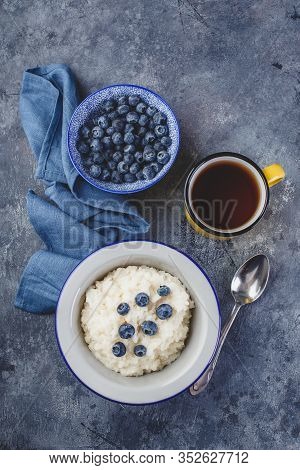 Milk Rice Porridge With Blueberry, Creamy Rice Pudding Or French Riz Au Lait In A Metal Bowl And Ena