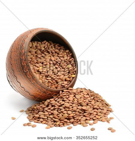 Lentils In The Ceramic Bowls Isolated On White Background. There Is Free Space For Your Text.