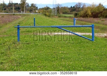 Closed And Open Strong Blue Metal Ramps Put Around Gravel Path To Prevent Vehicle Access To Grass Co