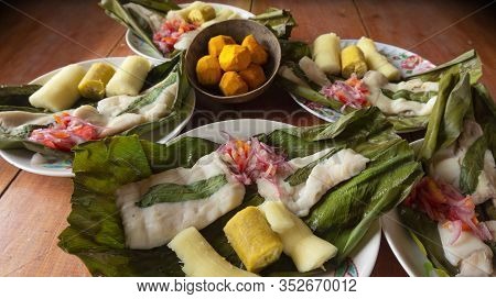 Dishes With Fish Maitos, Typical Food Of The Ecuadorian Amazon, Accompanied With Cassava, Cooked Ban