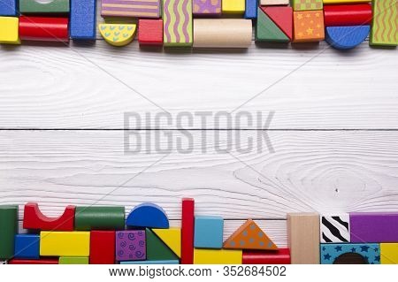 Kids Educational Developing Toys Frame On White Background. Top View. Flat Lay. Copy Space For Text
