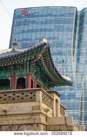 Seoul, Republic of Korea - March 2019: Dongshipjagak, ancient watchtower, Seoul landmark. Modern office buildings in the background.