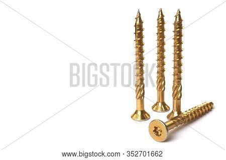 Gold Torx Screw Isolated On White. Yellow Zinc Chipboard Screw Torx, , Full Thread Close Up