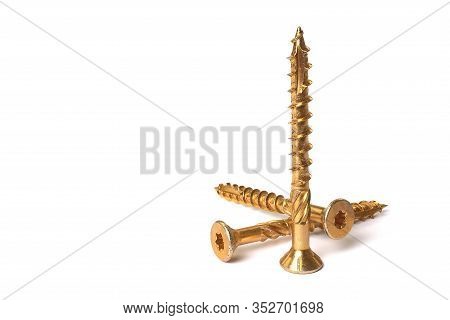 Gold Torx Screw Isolated On White. Yellow Zinc Chipboard Screw Torx, , Full Thread Close Up