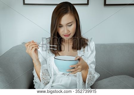 Thai Women Eating Food At Night. Asian Girls In White Nightgown & Long Sleeve Satin Robe With Floral