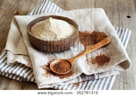 Teff Flour In A Bowl And Teff Grain With A Spoon Close Up