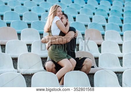 The Girl Sits In The Arms Of A Guy