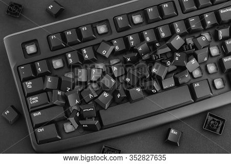 Heap Of Removed Keys From A Keyboard Laying On The Keyboard. Black And White. Close Up.