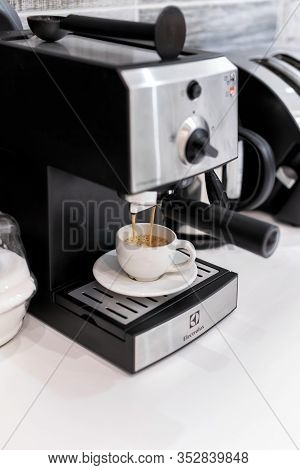 Budapest, Hungary - February 27, 2019: Coffee Making Process With Household Electrolux Coffee Machin