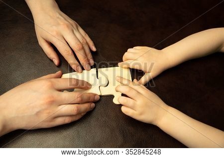 Collecting Pazzles, Building Future. Close Up Shot Of Female And Kids Hands Doing Different Things T