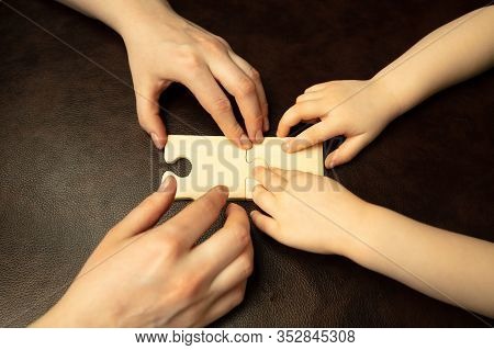 Collecting Pazzles, Building Future. Close Up Shot Of Female And Kids Hands Doing Different Things T
