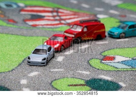 Toy Car Traffic Jam In Front Of Roundabout On Car Town Carpet Street