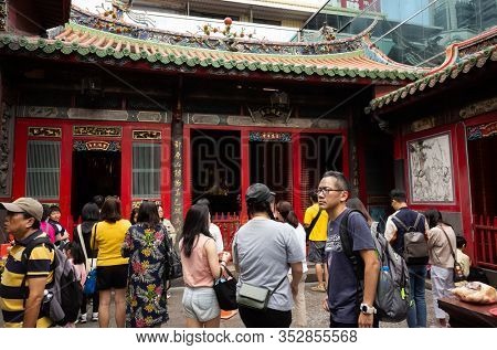 Taipei, Taiwan - October 20th, 2019: people praying in Lungshan temple at Taipei, Taiwan