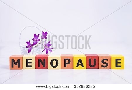 Menopause Word Written On Wood Block. Menopause Text On Table, Concept