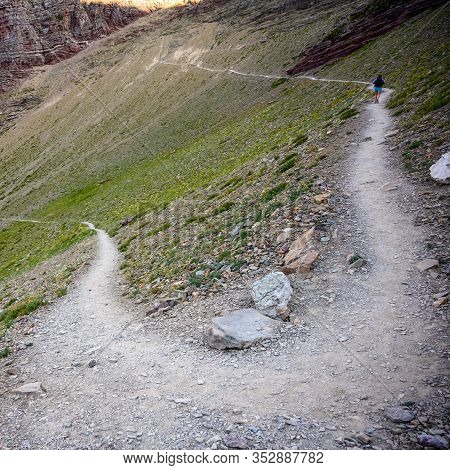 Hiker Passing  Steep Switchback Up To Mountain Overlook