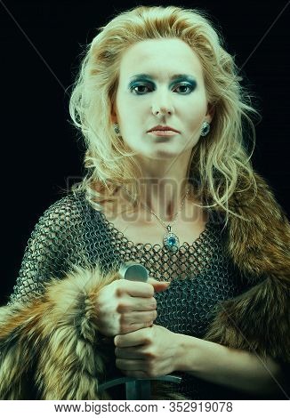 Valkyrie. Viking Fashioned Girl With Sword Medieval,