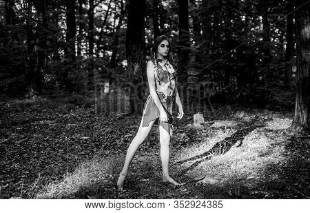 Ethnic Tribal Fashion. Deep Forest. Cougar Female. Amazon Woman. Sexy Witch. Wild Woman In Forest. S