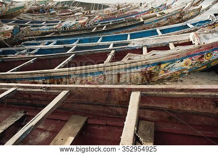 Kayar, Senegal - January 17, 2020: Traditional Painted Wooden Fishing Boat In Kayar, Senegal. Africa