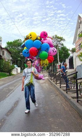 A Guy In A Cocked Hat Going To A Party With Bright Balloons. Voronezh. Russia. May 2012