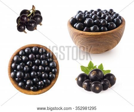 Black Berries On White. Blackcurrants In A Wooden Bowl Isolated On White Background. Blackcurrant Is