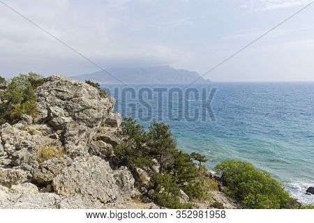 Crimea. Clouds And Haze Over Kapsel Bay. View From Cape Alchak Towards Cape Meganom.