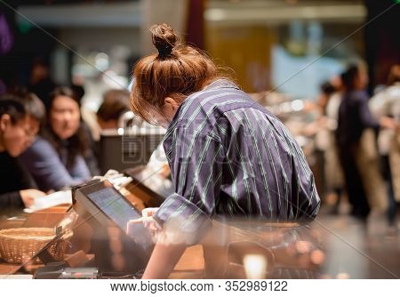 Shanghai, China - January 11, 2020: Unsprcific Employee Is Doing Their Work At The Starbucks Reserve