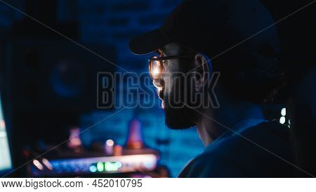 Close-up Of A Boy Focused On The Computer With Soft Light