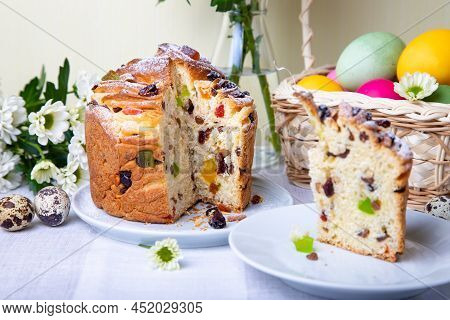 Craffin (cruffin) With Raisins And Candied Fruits. Easter Bread Kulich And Painted Eggs. Easter Holi