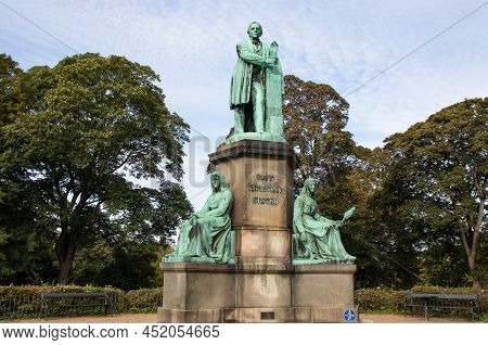 Copenhagen, Denmark- November 10, 2021. Oersted Park In The City Center. Hans Christian Oersted Monu