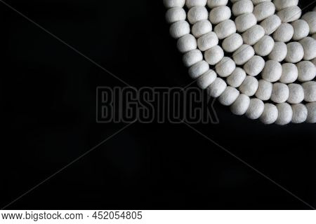 White Wool Felt Balls On Black Background Flat Lay In The Top Corner