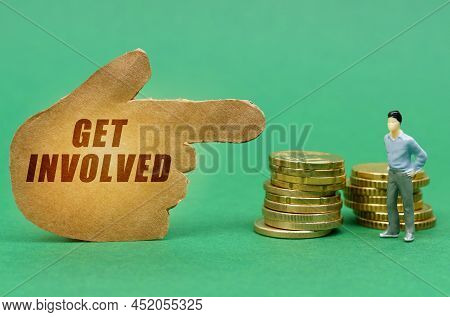 Business And Economy Concept. On The Green Surface Of The Coin And A Figure Of A Man, They Are Indic
