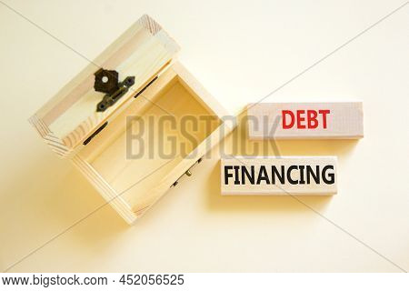 Debt Financing Symbol. Concept Words Debt Financing On Wooden Blocks On A Beautiful White Table Whit