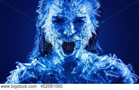 Female Face Covered With A Lot Small Pieces Of Glass Or Ice