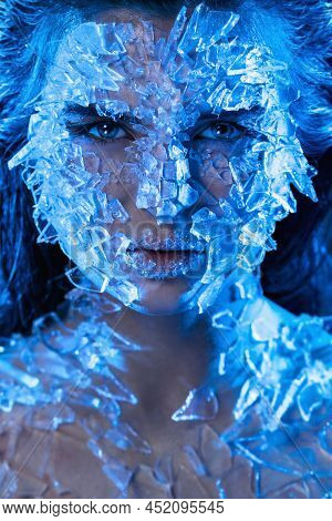 Female Face Covered With A Small Pieces Of Glass