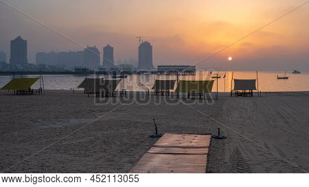 Doha, Qatar - March 03,2022 :beautiful Katara Beach During The Early Morning With Mist In The Backgr