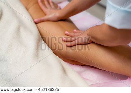 Facial Massage. A Woman Is Given A Massage In A Beauty Salon. Close-up.