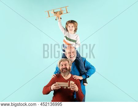 Fathers Day. Kid Having Fun With Toy Plane. Men Generation Family With Three Different Generations A