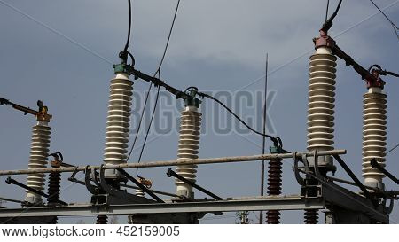 Power Station. Transmission Towers To Provide Energy To A Residential Area. Steel Structures For Gen