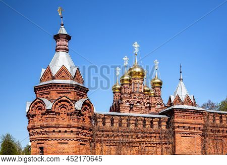 Golden Domes Of The Cathedral And The Towers Of The Monastery Wall. Chernigovsky Skete In Sergiev Po