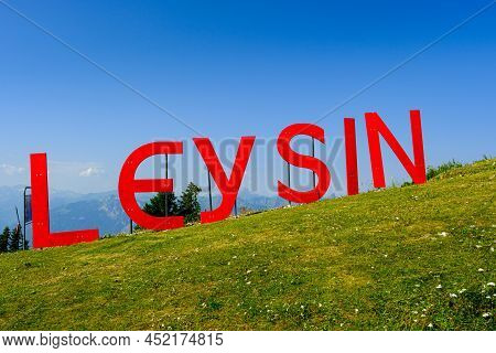 Leysin, Vaud, Switzerland - August 1 2020 : Red Letters On Fresh Green Alpine Meadows Forming 