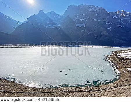 Frozen Klöntalersee Or Klontaler Lake During Early Spring In The Alpine Valley Klöntal (kloental Or 